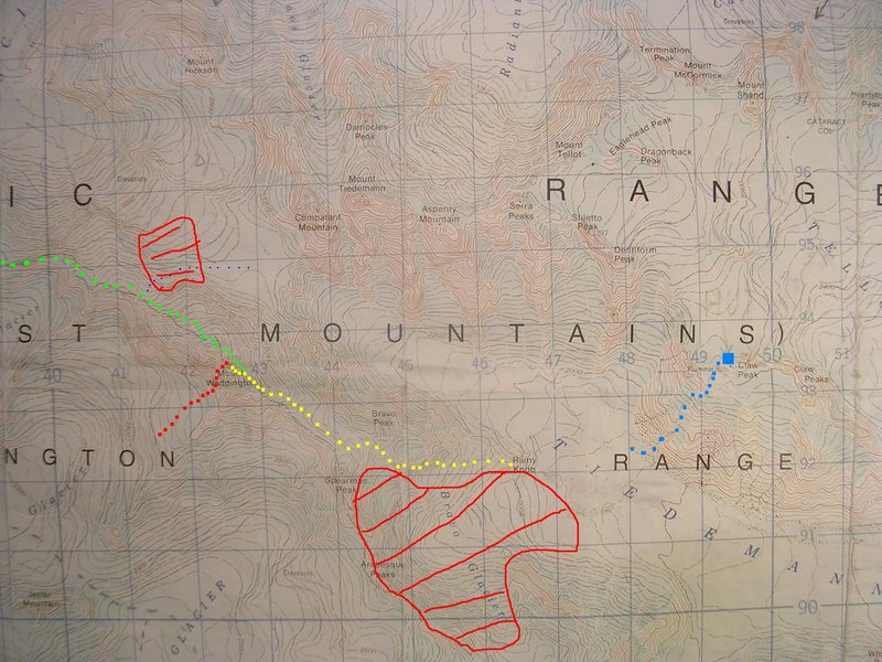 Mount Waddington Route Map<br>
contour interval: 40 meters<br>
grid: one kilometer squares<br>
<br>
Red - Wiessner-House Rt<br>
Yellow squares - Bravo Gl Rt<br>
Green - Fury Gap-Angel Gl Rt<br>
Red zones - Avalanche!<br>
Blue Square - Plummer Hut<br>
Tiny blue dots - Many near misses