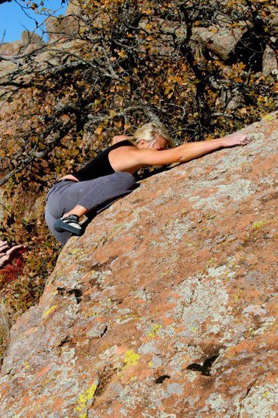Success! She pushed through the mantle, found the topout crimper, and snagged the first ascent!
