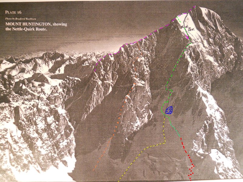 Washburn photograph<br>
Black line by James Nettle<br>
AAJ, 1990<br>
<br>
Black/yellow line - Nettle & Quirk's approach route, via the left side of the ice-fall. Harder and slower, but safer, unless the mountain is not frozen. This is also how Puryear shows the approach in his guide. <br>
<br>
Nobody seems to heed the advice. That might be because moving fast, before getting frozen, is worth risking the seracs.<br>
<br>
Red dots - The approach used by most teams now, hidden in this photo by the threatening seracs. Morning sunhit on the seracs does seem to wake them up.<br>
<br>
Red dashes - Easy part of the modern hike/ski to the bergschrund. Also threatened by avalanching more than Nettle and Quirk's approach.<br>
<br>
Green dashes - Variations used now to avoid rock slabs with shallow coverage.<br>
<br>
Blue S - The dangerously anchor-less slabs that must be avoid both on the ascent and descent. Climbers still had to work hard to find good anchors, left of the rock slab, in the deep snow of May, 2010.<br>
<br>
Orange dashes - Colton-Leech Easy to reach from the TAT landing zone. C-L also seemed to get less powder slough activity than West Face Couloir.<br>
<br>
Violet dashes- French Ridge