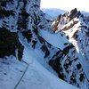 (Mar 2005) A mixed vertical wall (M4+?) at the final pitches. We flashed to the left and to find a snow path (60-70 degress) to the summit