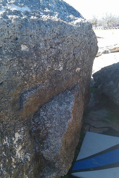 Start on the far right side of the rail in the center of the picture.