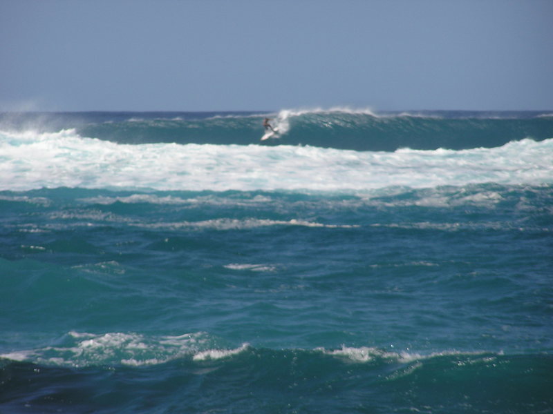Michi Schweiger dropping in on a big right hander. The waves in front of him make the one he's on look small.