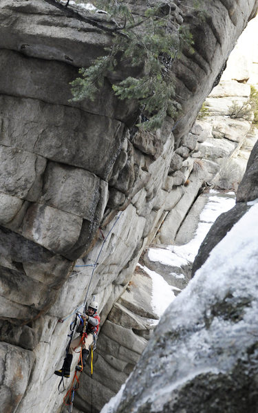 Max cleaning the route after the first ascent. This shows just how steep the route actually is. Overhangs about 15 feet total.
