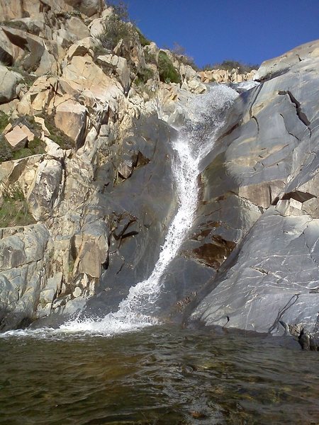 The climb is to the left of the falls.