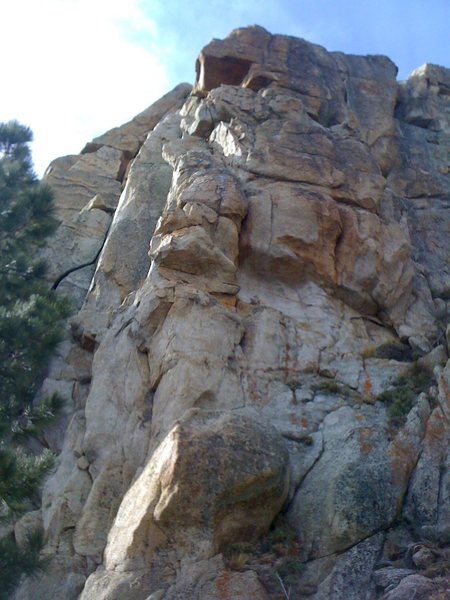 Looking up the arete. The route starts in the middle of the wall, moves left to the arete and back to the right side of the wall.