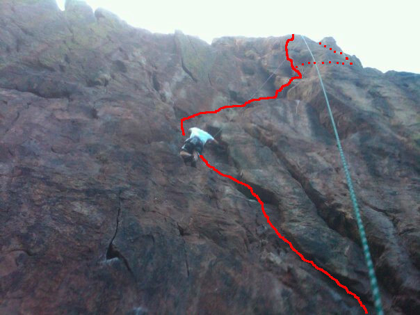 Cell phone photo of Mickey making his way to the ledge. I drew the route out (badly), as well as the variation we ended up taking after not being able to finish off the crux.