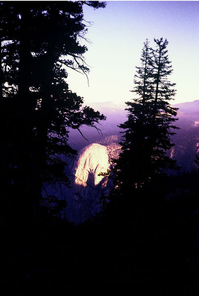 Tehipite Dome at sunrise, seen from camp under The Silver Turret.<br>
<br>
Photo by Guy Keesee, 1992.