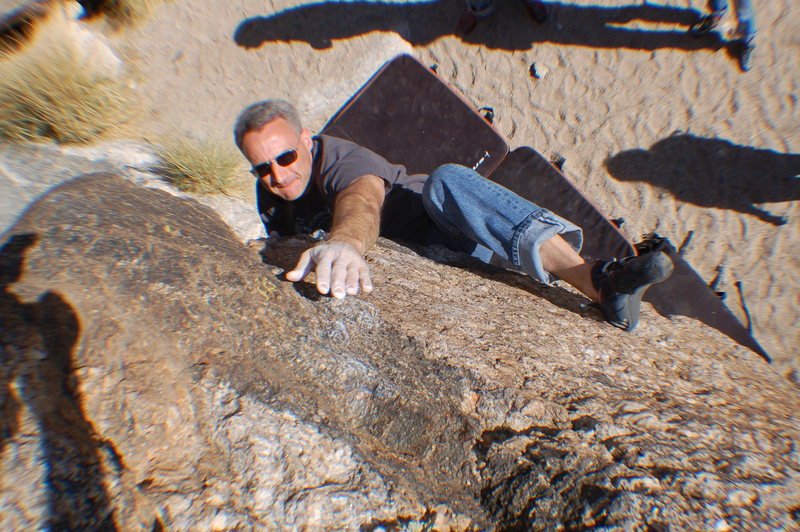 Crux move. Getting the heal to stick on a long deadpoint.