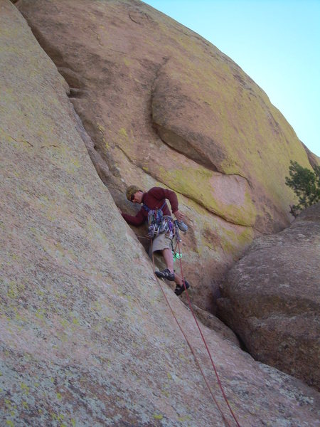 Wyatt starting up the shallow groove above the boulders on pitch 5