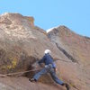 Just below the crux.  Footholds on the face make the setup for the pull over the roof a little easier.