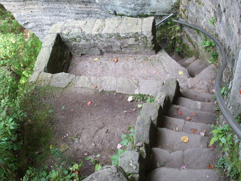 The small overlook near the bottom of the staircase that leads through the rocks to the base.