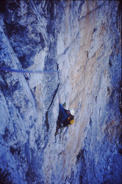 Susan Wolfe climbing the crux 5.12a/5.10 A1 pitch 3