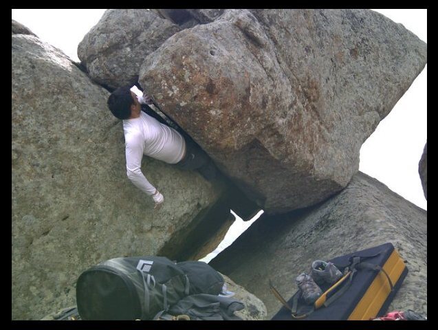 Direct Variation to "Jaws of Life" instead of finishing out on the face, continue out the offwidth crack. Just take the direct line out of the cave. Tricky offwidth moves.