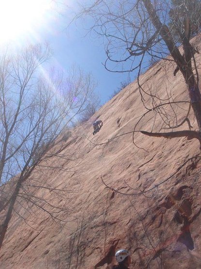 23MAR11 Red Rock Canyon O[en Space Celena's 1st .12a on slabby sandstone UP UNTIL SUNRISE (Lee Rittenmeyer leading it)