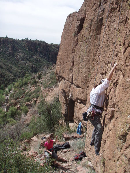 Karen heads up True North (5.6) as Susan belays.