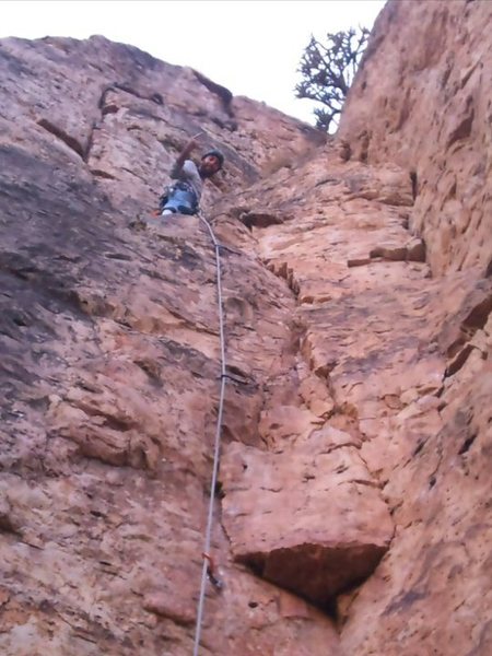 Standing on the ledge before the crux to the top.