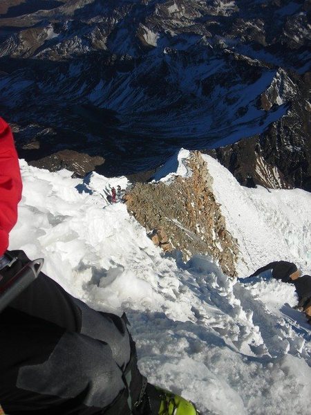 Climbers making the final push to the top along a beautifully exposed ridge.