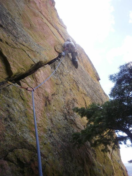 Short pitch with ever increasing difficulty. Starting the brutal crux near the top (thin hands, no feet).