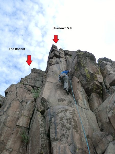 Red arrows show location for "Unknown 5.8" & "The Rodent". Mike Keegan climbing Unknown 5.8.