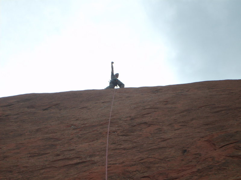Chad Moore at the top of the route, picture is taken from the belay ledge looking straight up the route.