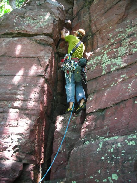Mike Sohasky starting up the first pitch of adventure climb "Jungle Gym" on toasty June day. Major Mass, Devil's Lake.
