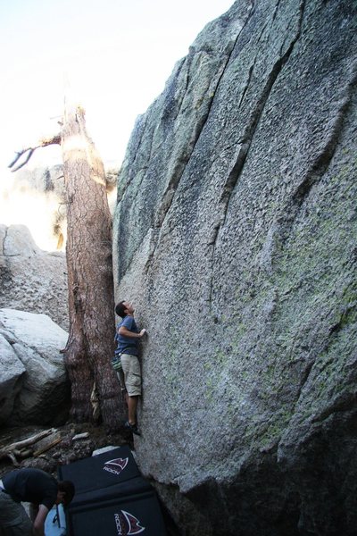 A climber on the start of Emerald City, V0