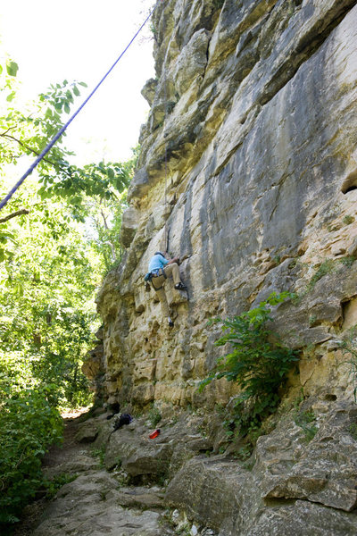 Michael McKay climbs through the opening layback section of Three Horns, at Capen Park.<br>