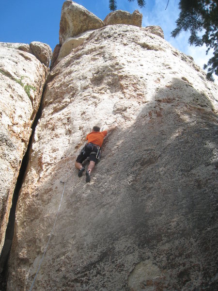 Working up along the second flake, at the end of the crux.