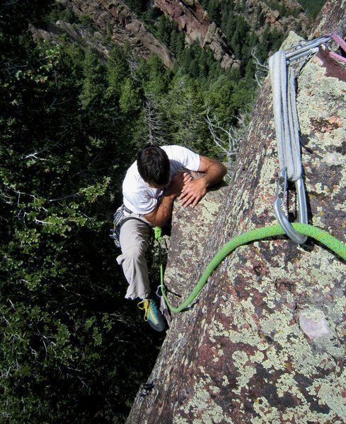 Tony B over the roof on "Supposed..." happy to be on secure holds and trying to establish feet. Photo by Micah, 6/2011.