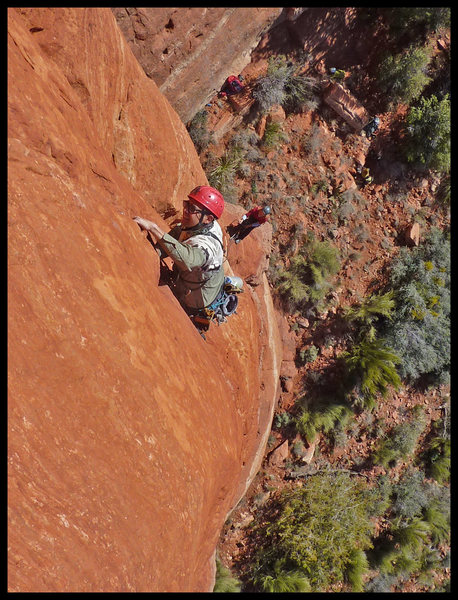 Manny leading the second (crux) pitch of Black Arrow in Sedona, with Catherine belaying.