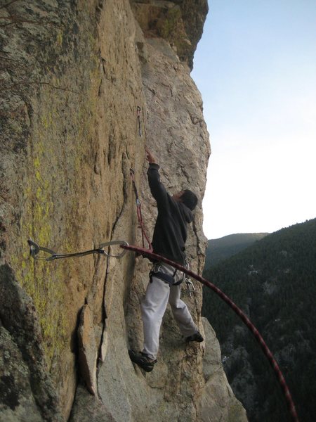 Andy Nguyen sews up Moby Dike. Photo by Chris Perkins.