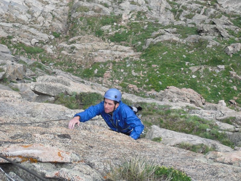 Josh traversing right on pitch 3 to get to the flake after the roof.