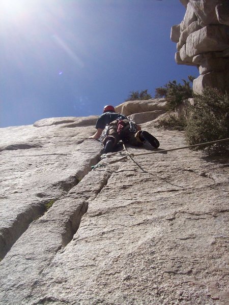 Josh leading up the 5.9 crack towards the end of pitch 2.