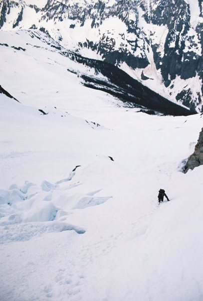 Traversing around crevasses beneath the steep west-ridge route couloir. June 2011
