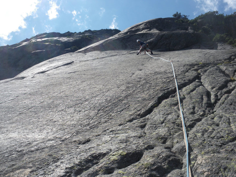 Pitch 3: Some run out on slab. Crux is the crack right/above climber