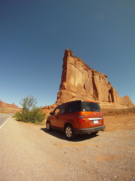 Honda Element. <br>
-MASSIVE cargo capacity.<br>
-4WD<br>
-Good mileage.<br>
-Super reliable and will go forever.<br>
-Made to sleep in. The seats convert into beds.<br>
-Smooth road tripping comfort.<br>
-Awesome sound system!