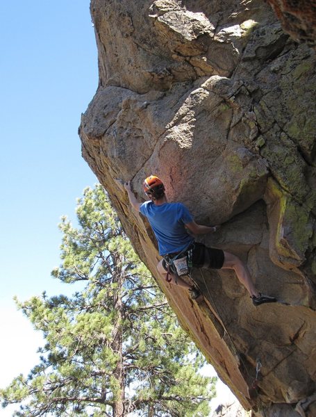Going left: Reaching past the arete from the big undercling.