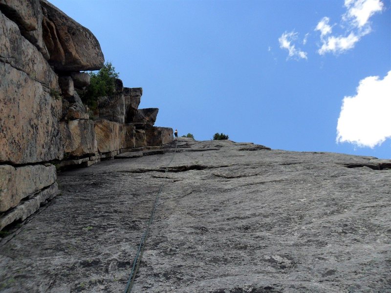 Brenda makes the long rappel from the Zanzibar Dihedral anchors -- two ropes are definitely required.
