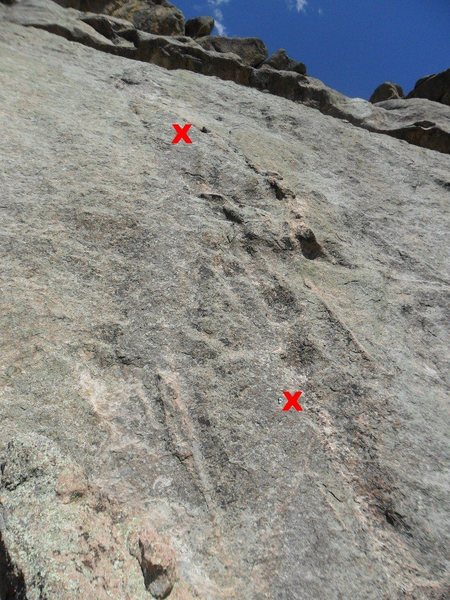 The two bolts on Arch Rock Direct -- picture taken from the anchors of the Middle Dihedral route. Above the 2nd bolt, it is very runout, but on very easy rock. The next protection is about a #1 Camalot in the crack under the lip of the overlap at the top right of the photo.