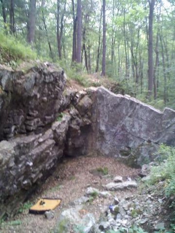 Most of the main wall and right corner. The slab on the right is about 15 feet and the main wall gets to about 20 feet or so depending on where you are. To the obvious ledge about mid way above the pad is about 10 feet or so.