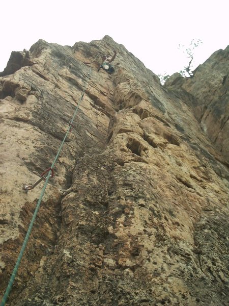 Just below the crux. One or two more bolts to the anchor.