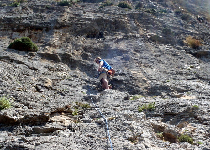 Below the overhang in the middle of the route.