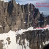 from Brian Webster (Canadian Mountain Guide): When<br>
traversing left on the large snow slope (after topping out on the Big Step)<br>
you will encounter an obvious rock pinnacle that originates from the snow<br>
slope and is about 10 metres high. (If you are traversing the snow slope<br>
near the top, close to the moat, you would bump into this pinnacle.) The<br>
exit gully is just on the other side of the pinnacle, but  most climbers<br>
scramble up between the pinnacle and the main wall (you can create a belay<br>
by slinging the top of the pinnacle). From here climb loose rock up and<br>
left so as to merge into the exit gully higher up. It is about 5 pitches of<br>
loose 5.4ish rock and/or snow and ice climbing to reach the summit ridge.
