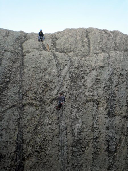 Rappeling down the Sylvan Lake side of the Outer Outlet, across from the Inner Outlet's Classic Crack