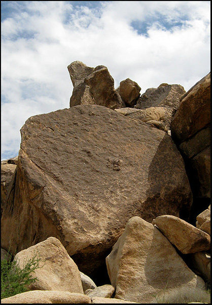 "Candyass" goes up just left of the center of the boulder.<br>
Photo by Blitzo.