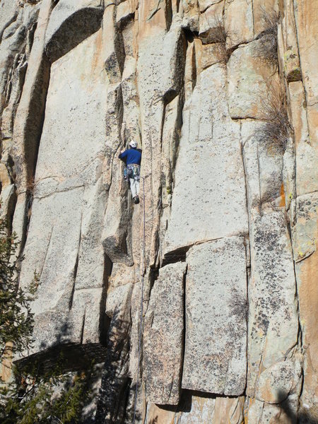 Mike Caputo climbing the bottom of the route. Oh Wilbur climbs the beautiful dihedral on the left side of the slab.