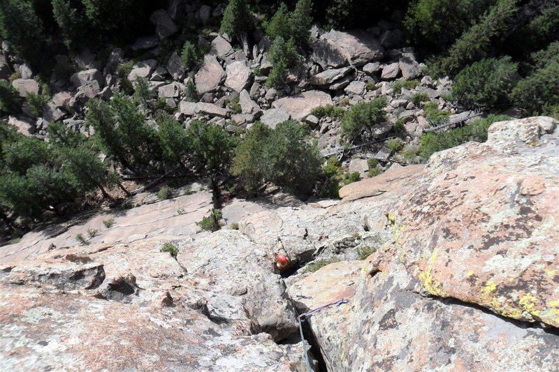 Looking down from the summit with Brenda on the comfy 2nd belay ledge and Sammy resting far below.