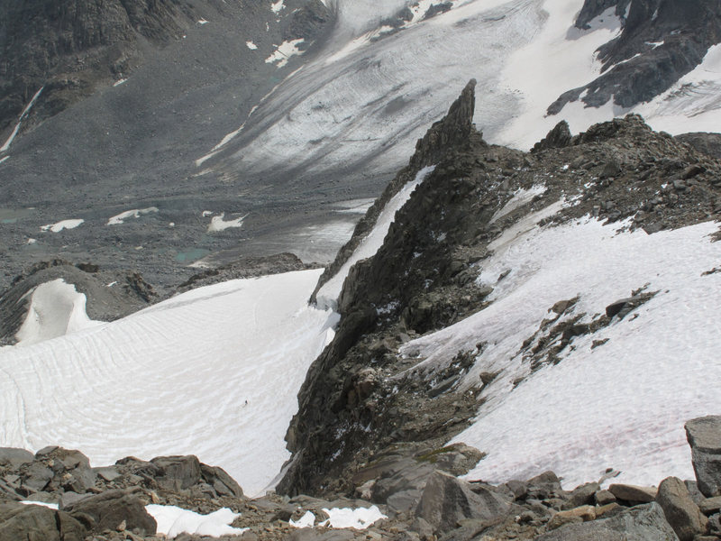 Wide angle view (from summit ridge) of climber stymied at the Gooseneck bergschrund