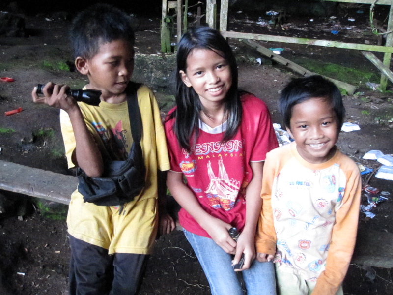 My three guides showing me around a new cave system, looking for potential climbing areas, Sabah, Borneo.