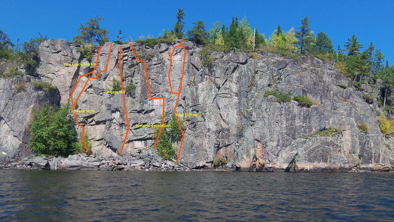 a-front-look-at-the-cliff-face-with-established-routes-marked